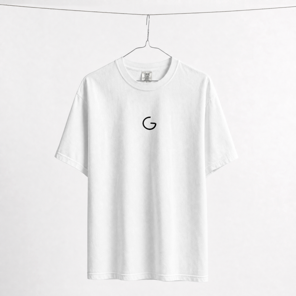 GRITO Core Tee in white — front with the G mark on the chest